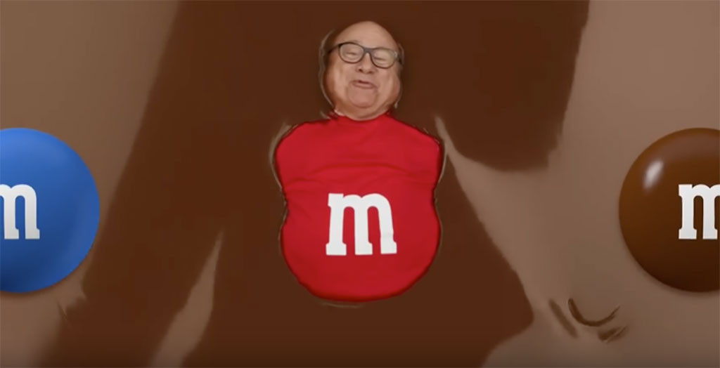 Danny DeVito Splashes in a Pool of Chocolate in This Bizarre M&M's