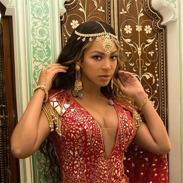 Beyonc Dazzles in Red and Gold at Indian Wedding Event