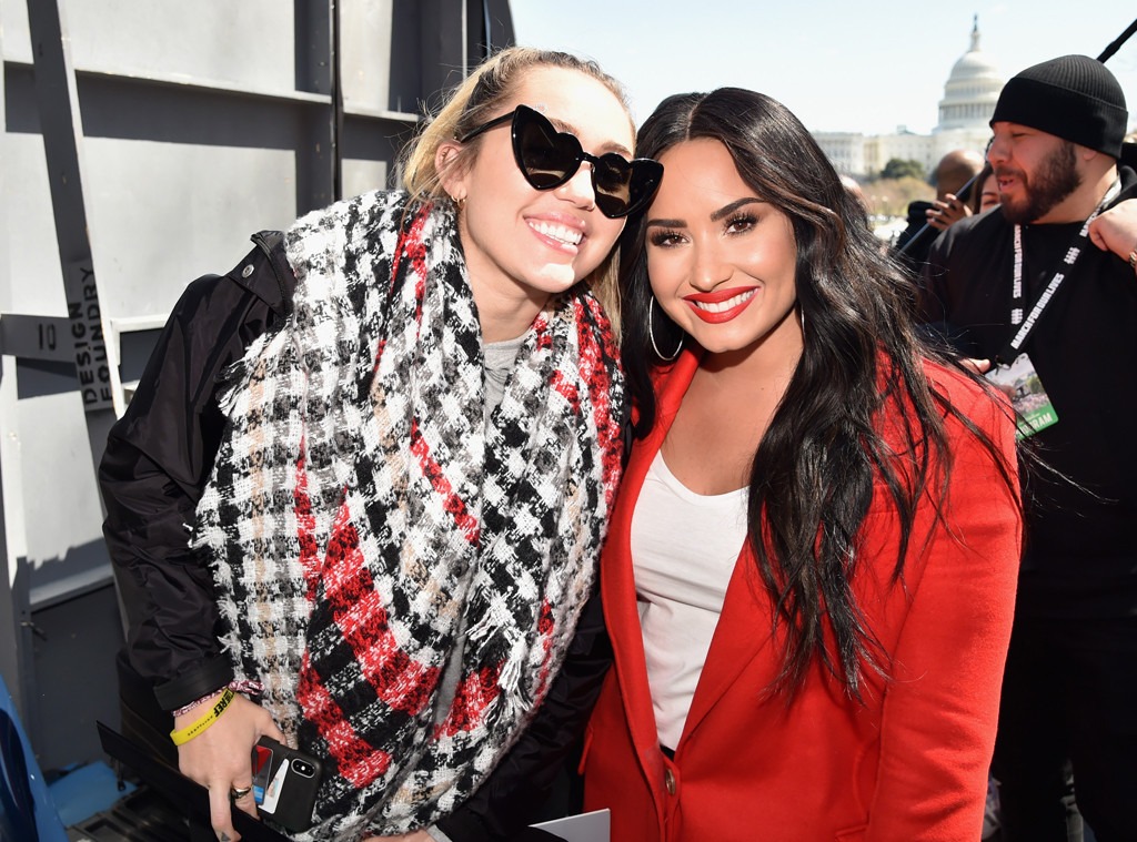 Miley Cyrus And Demi Lovato Join Forces At March For Our Lives E Online Ca Miley Cyrus And Demi Lovato Join Forces At March For Our Lives E Online Ca