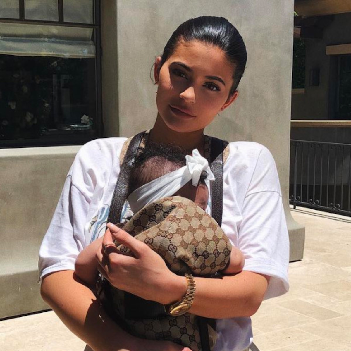 Kylie Jenner Holds Baby Stormi in an $820 Gucci Baby Carrier