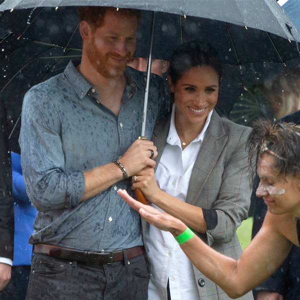 Meghan Markle Sweetly Holds Prince Harry's Umbrella in the Rain