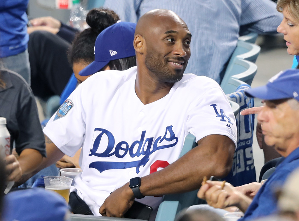 Rob Lowe and Jason Bateman sport fan merchandise at the LA Dodgers