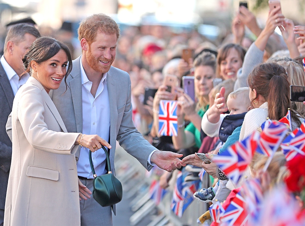 Prince Harry Kisses a Fan With Meghan Markle Nearby