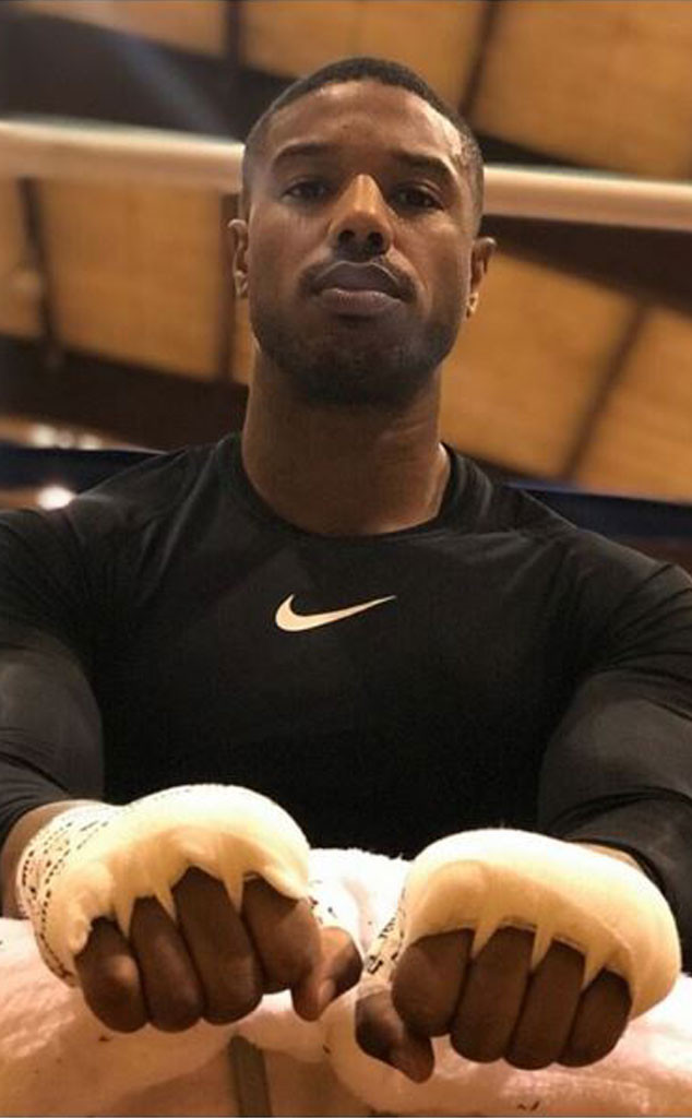 Michael B. Jordan flaunts his bulging biceps during photo shoot in