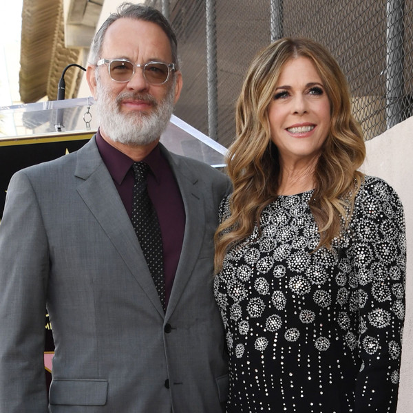 Tom Hanks cuts a dapper figure as he poses with wife Rita and son