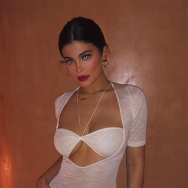 Kylie Jenner Shows Off Holiday Party Style in Leggy Feathered
