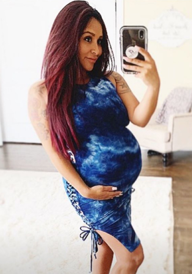 Jersey Shore star Snooki dresses her baby bump in a gaudy sequinned T-shirt  dress