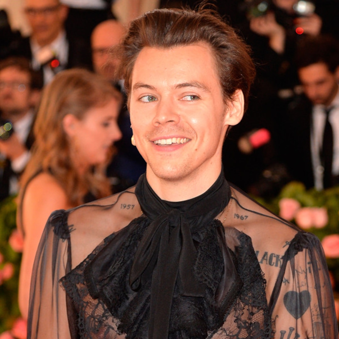 Harry Styles cuts a causal figure in a brown co-ord as he steps