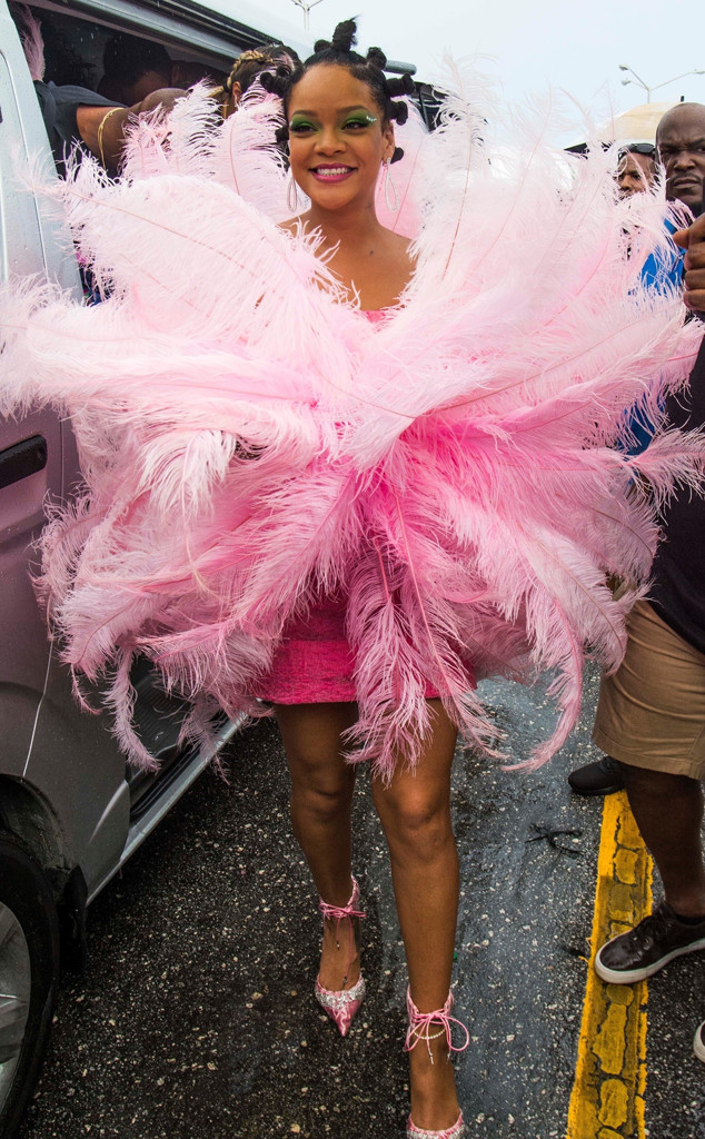 Rihanna makes jaws drop posing up in sexy low-cut dress during PFW  festivities