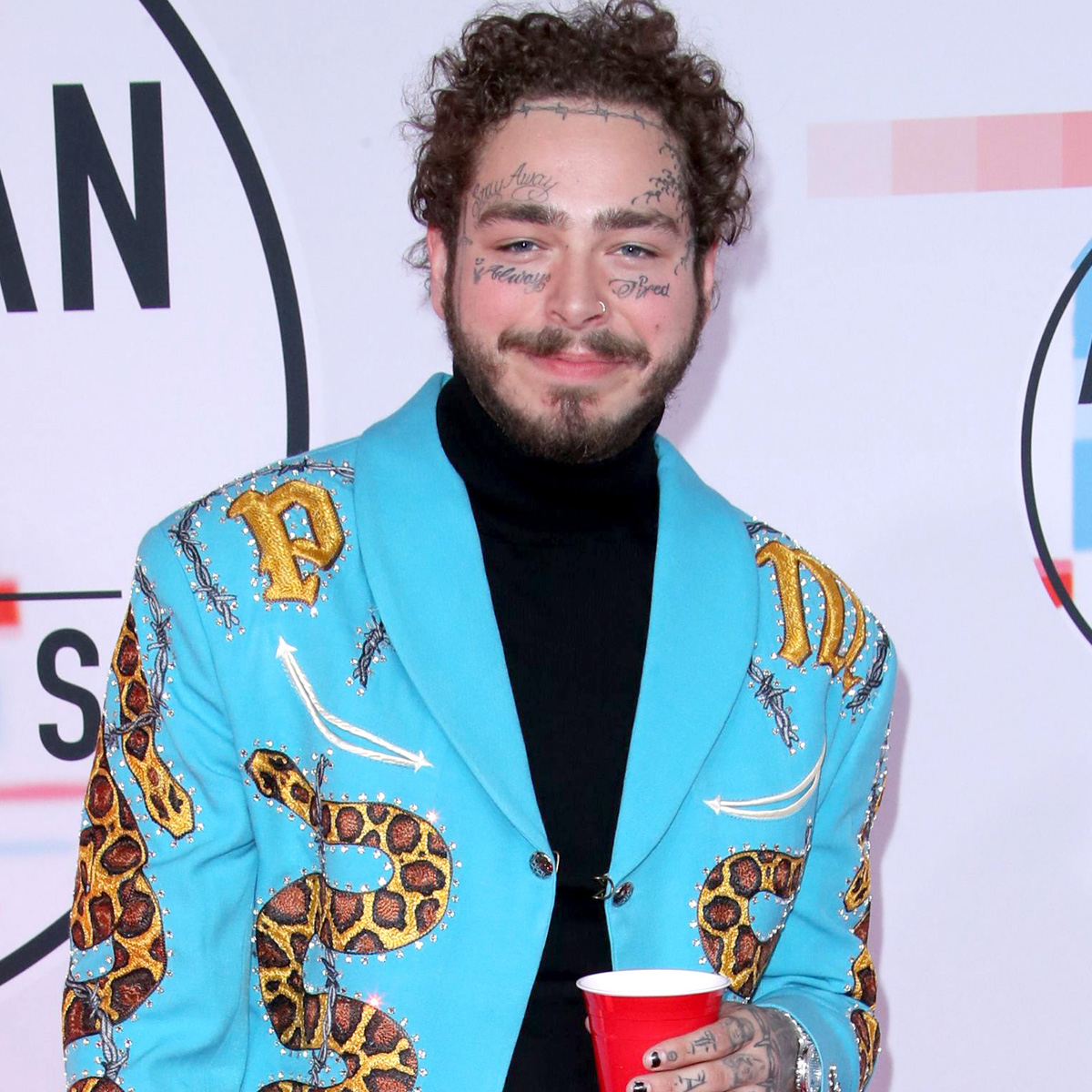 See Post Malone's $1.6 Million New Smile—Diamond Fangs Included