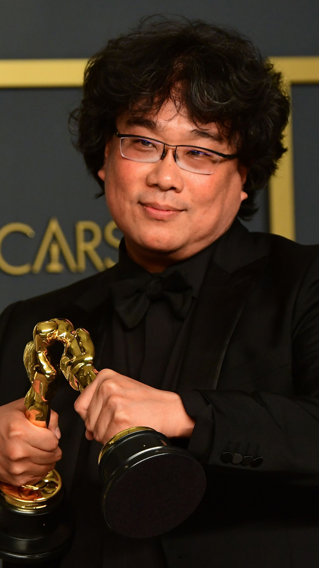 Parasite director Bong Joon Ho and cast members walking on the red carpet  at the 92nd Annual Academy Awards held at the Dolby Theatre in Hollywood,  California on Feb. 9, 2020. (Photo
