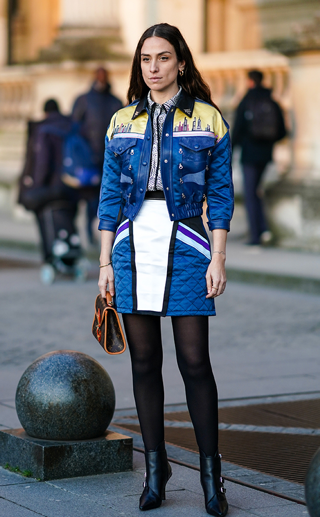 Elva Ni wearing Louis Vuitton white jacket, blue skirt, pink bag