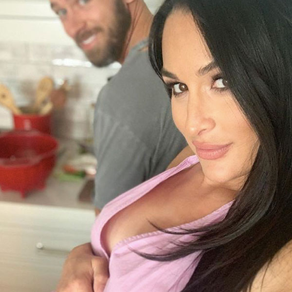 Nikki Bella is one stylish mom-to-be as she shows off a hint of baby bump