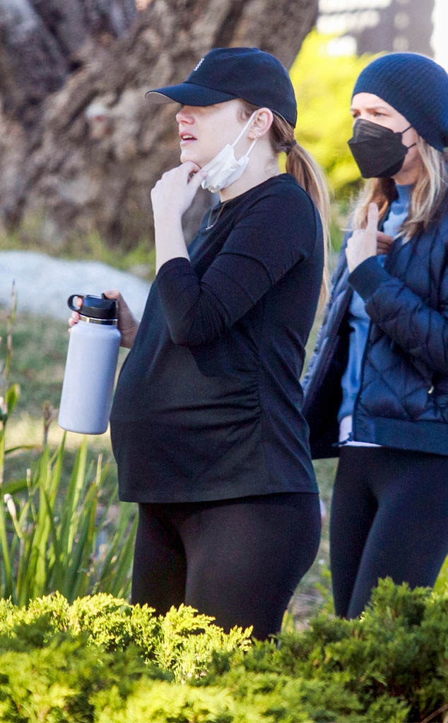 Emma Stone cradles baby bump as pregnancy is revealed