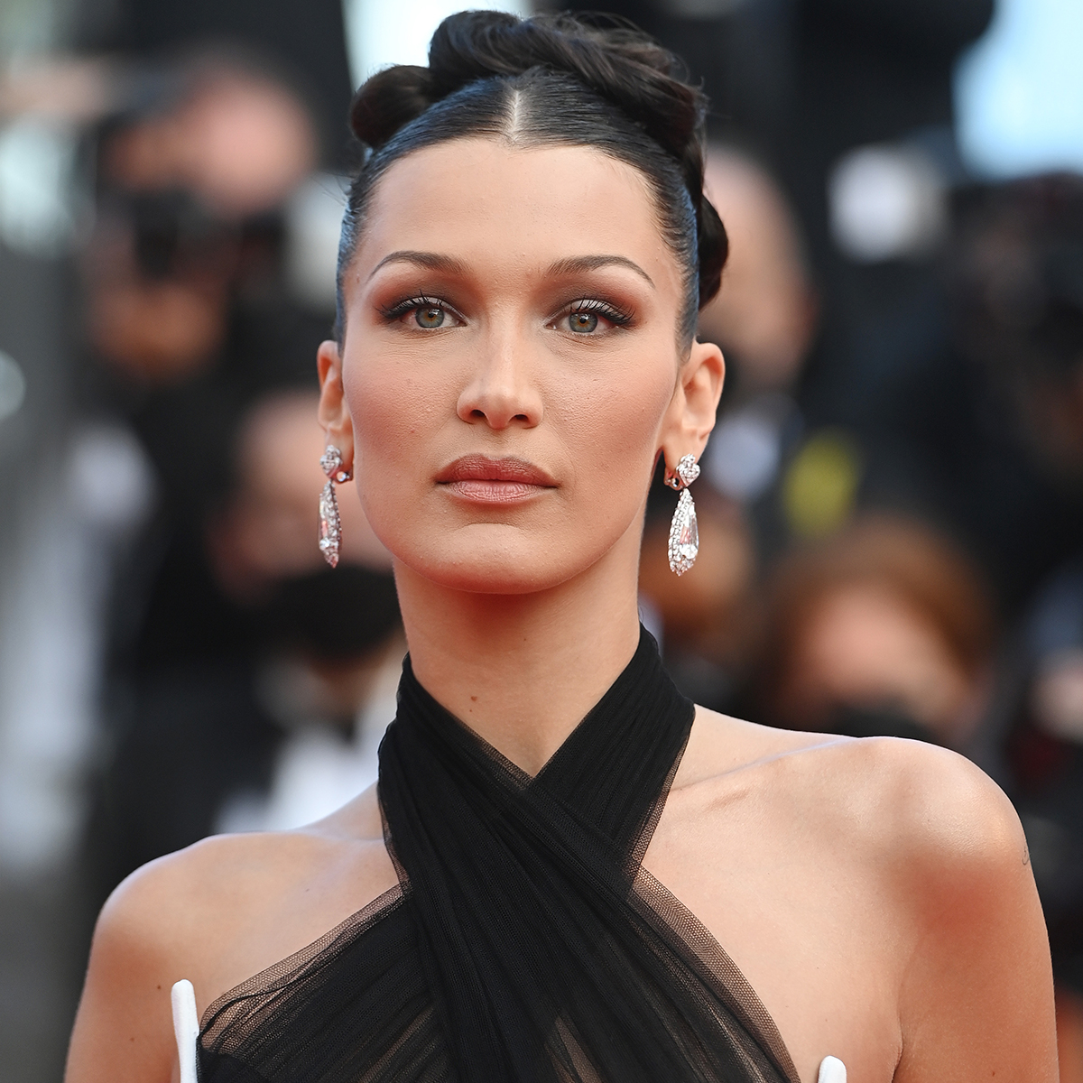 Bella Hadid flashes the flesh as ample assets spill out of