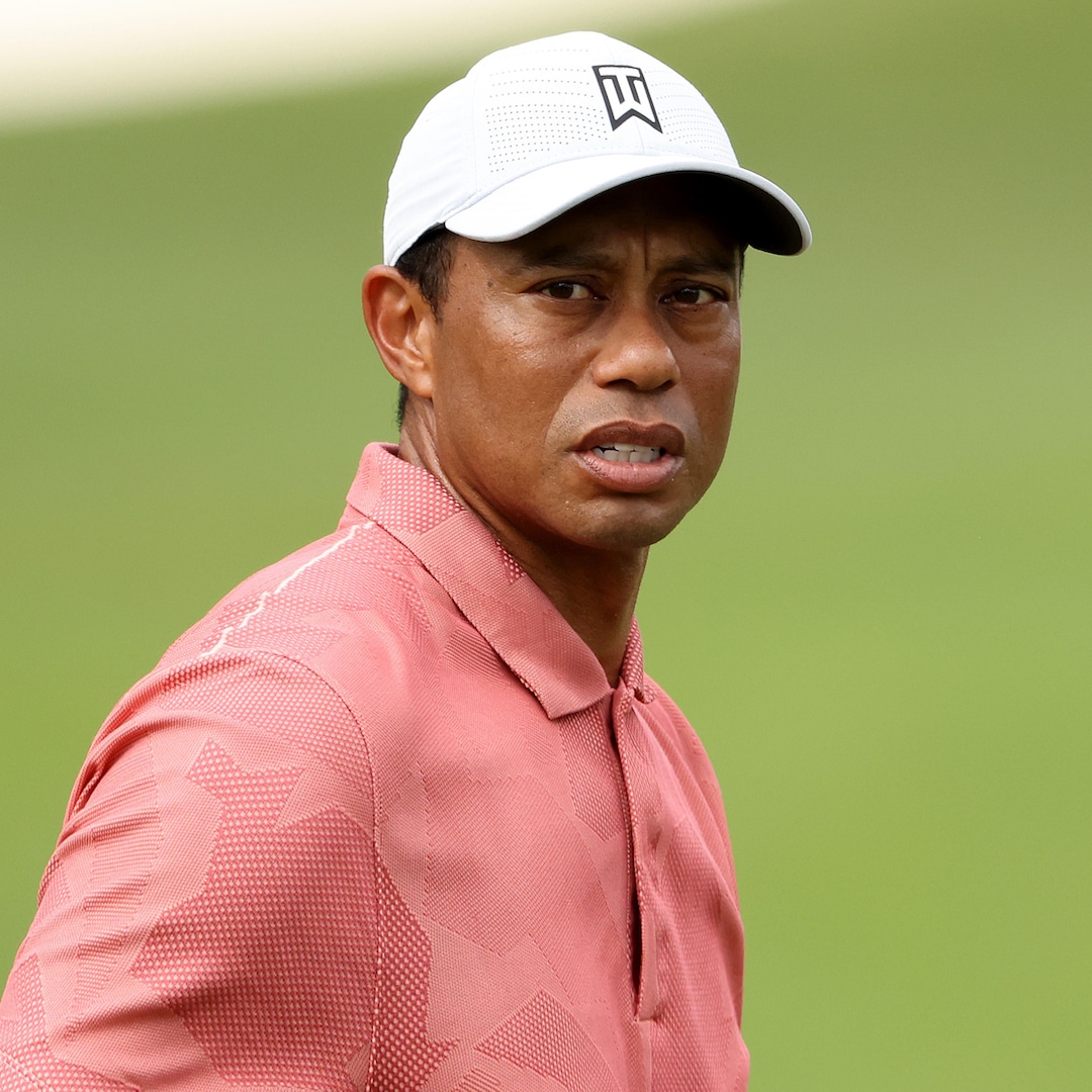 tiger woods seen on crutches in rare public appearance after car crash e online