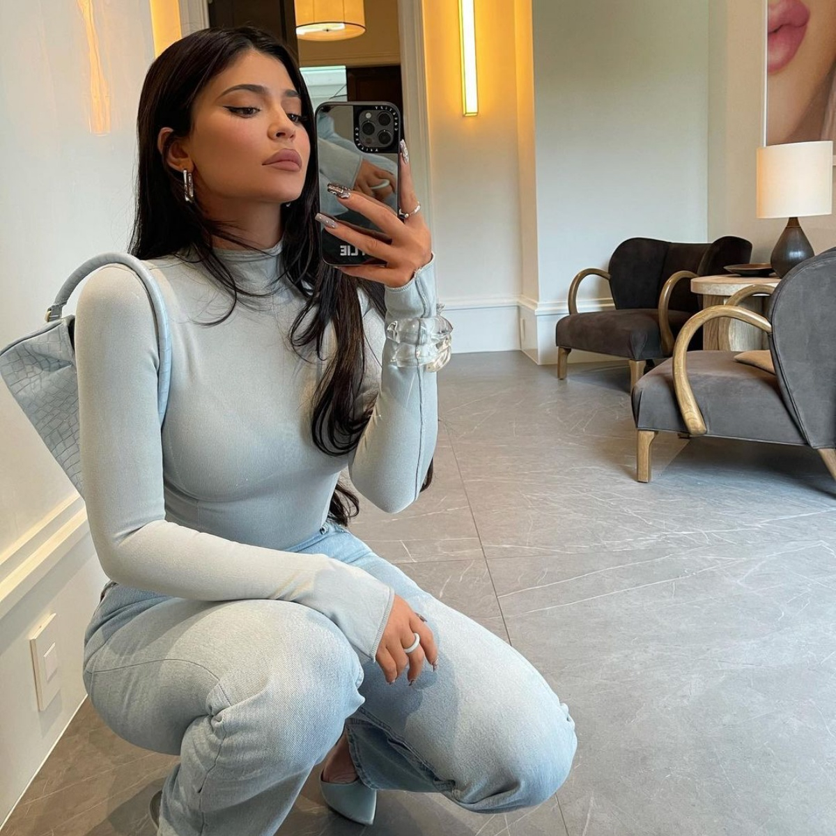 Kylie Jenner shows off major cleavage & her famous curves in a very low-cut  top for new Halloween video