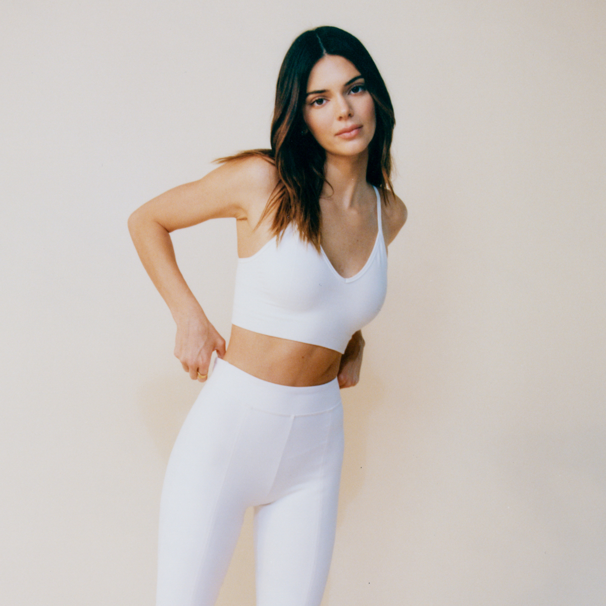 Who made Kendall Jenner's black leggings, sweatshirt, white sports