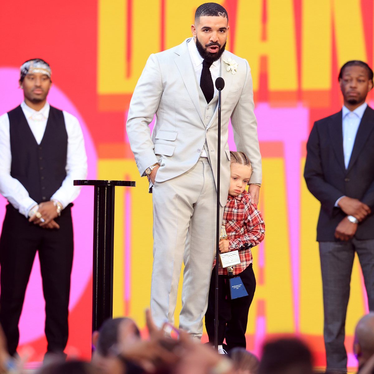 Drake and his son Adonis pose in matching outfits at mum's birthday party