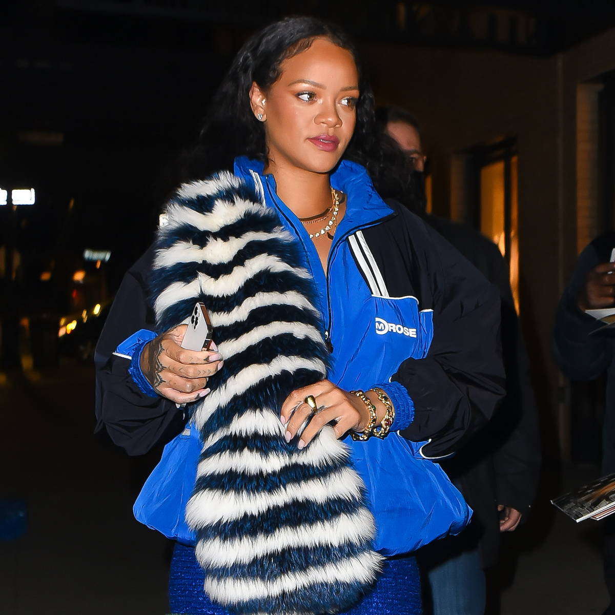 See Rihanna Pair a Bright-Orange Coat with Camo Pants