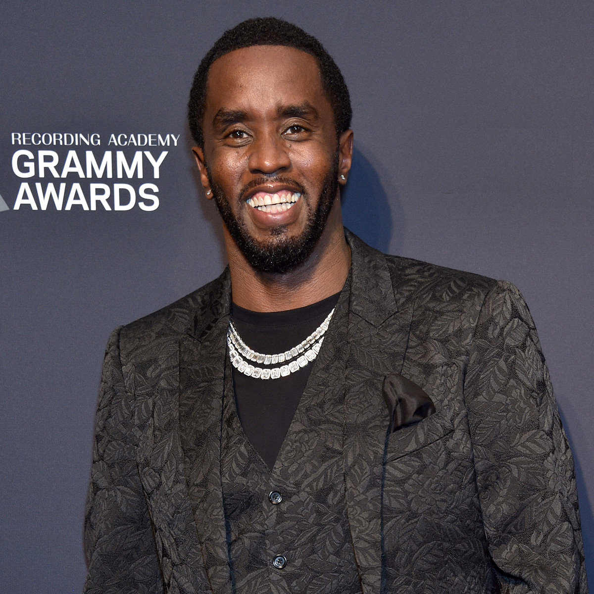 Diddy Shares First Glimpse of Newborn Daughter Love in Christmas Family Photo – E! Online