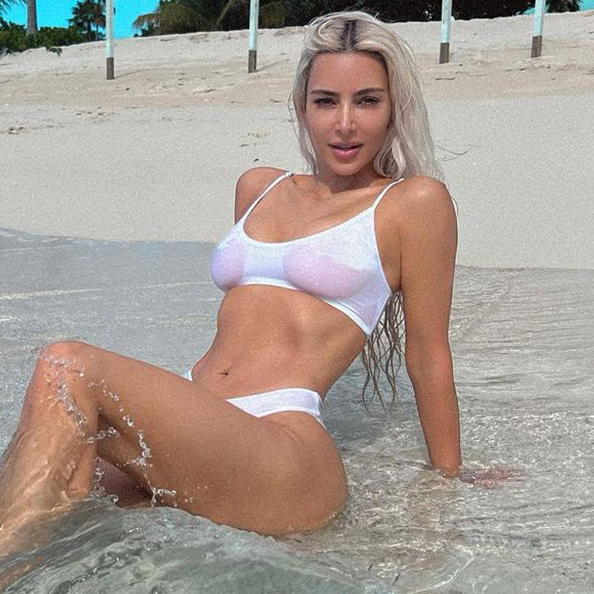 Kim Kardashian Shows Some SKKN in White Bikini During Beach Vacation – E! Online