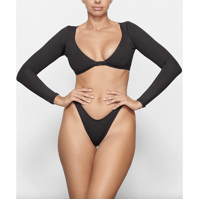 Kim Kardashian's SKIMS Just Launched Its First Swimwear Collection With 19  Silhouettes