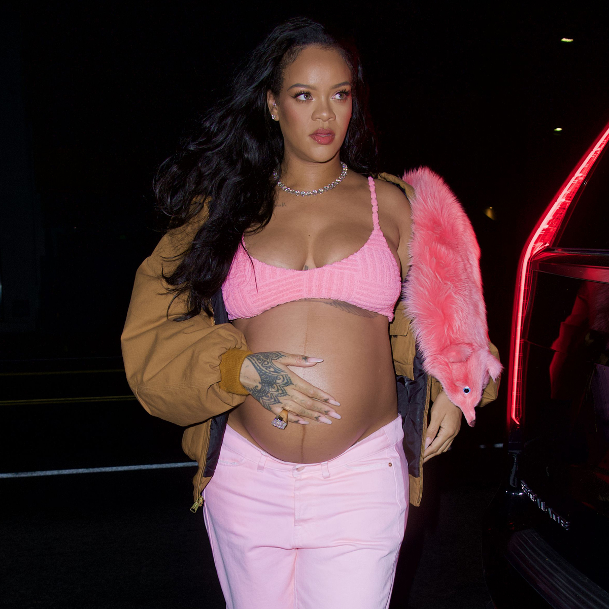 Rihanna Shows Off Baby Bump in Chic Jersey Dress
