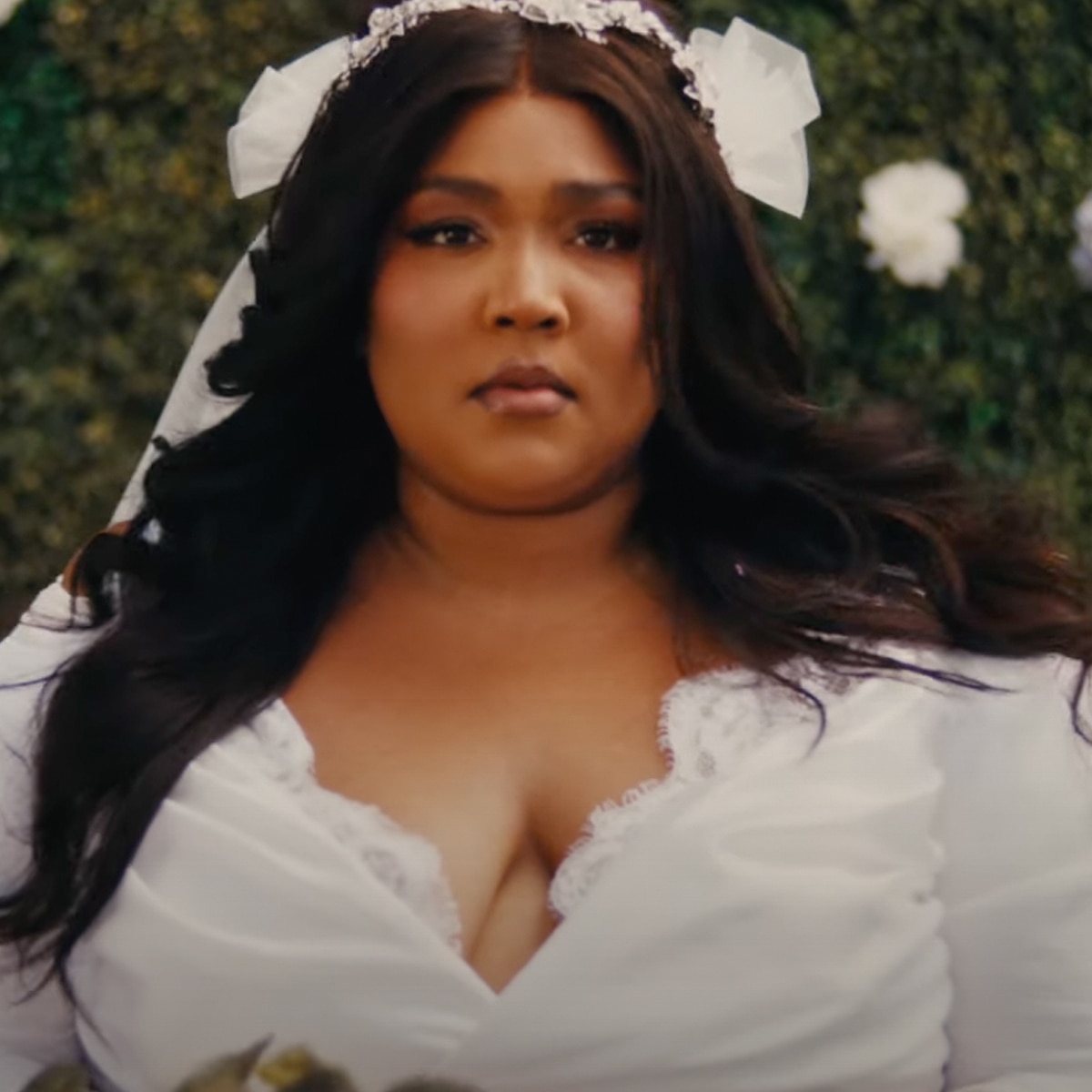 See Lizzo Rock a Wedding Dress and Kiss a Tree in