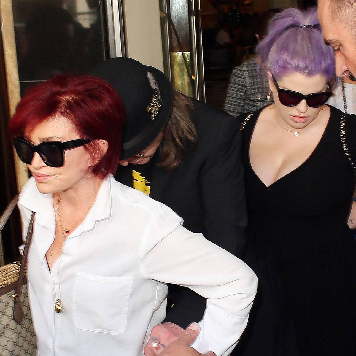 Pregnant Kelly Osbourne Steps Out in London With Parents Ozzy and Sharon Os...