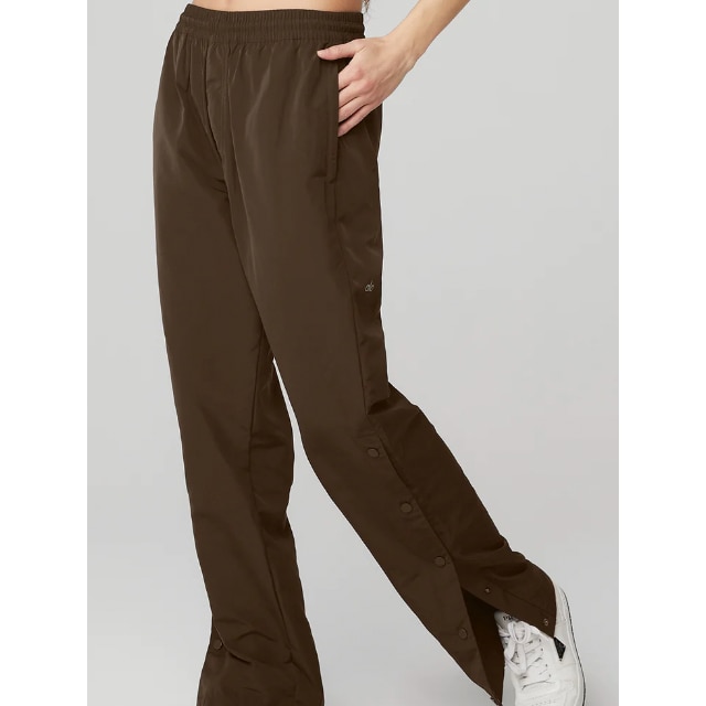 These track pants refashion an athletic style with a feminine touch.  They're made of soft satin a…