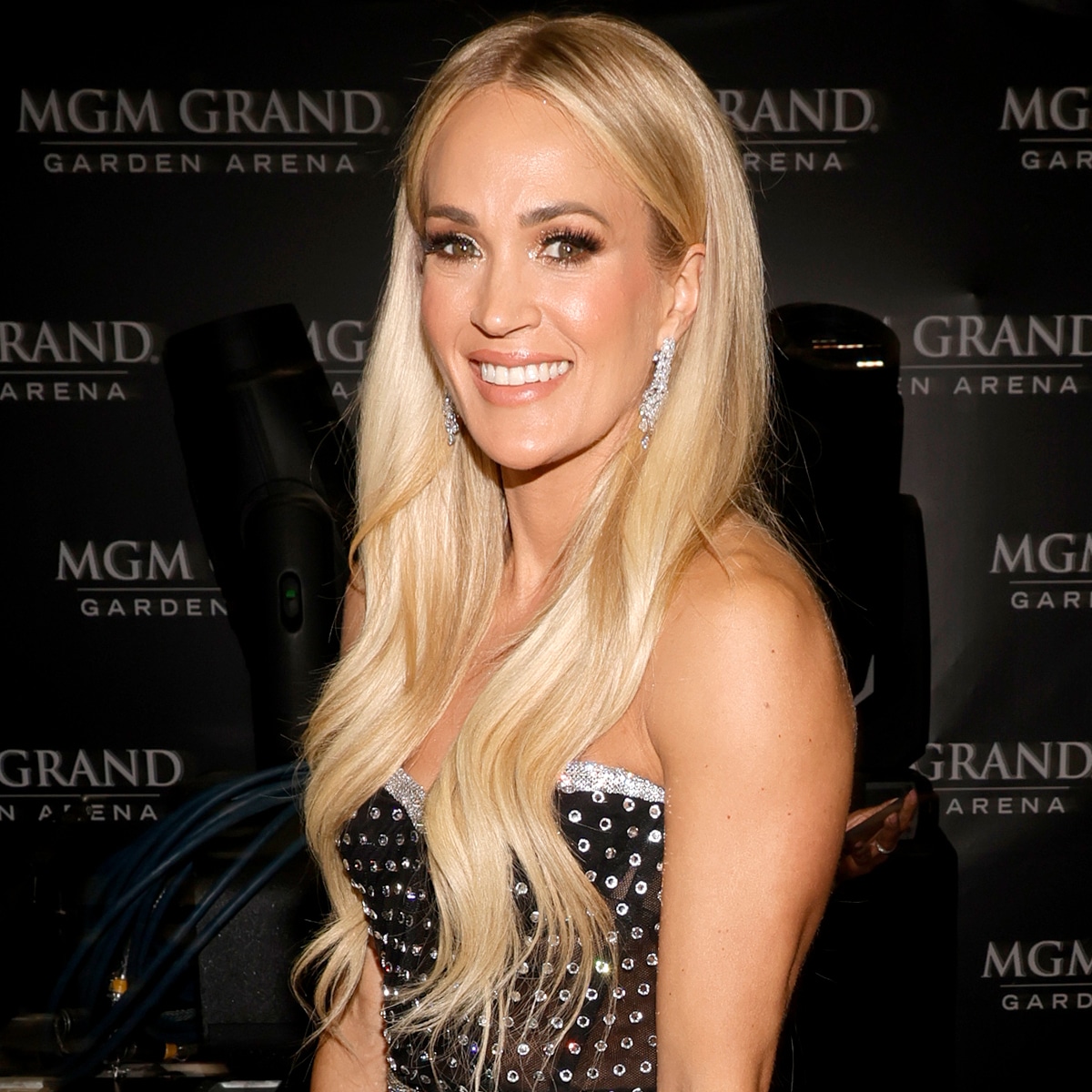 Carrie Underwood Sparkles in Purple Dress & 5-Inch Heels at CMT Awards
