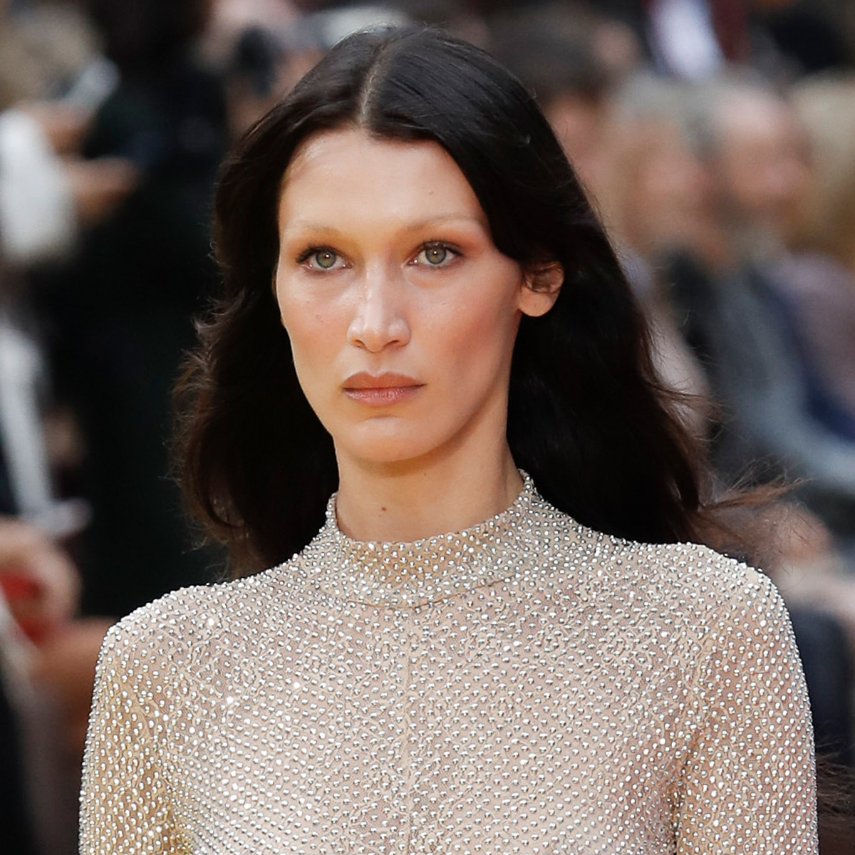 Bella Hadid goes TOPLESS behind massive LV bag for brand campaign