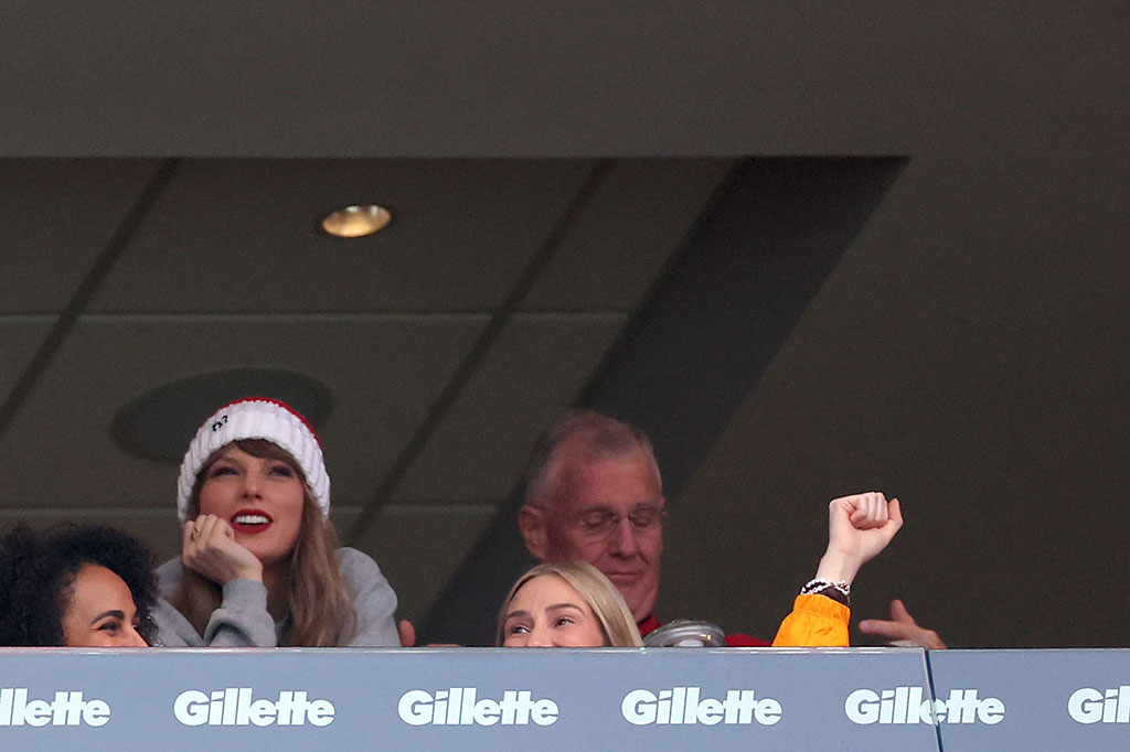 Taylor Swift and her dad cheer on Travis Kelce at Chiefs game