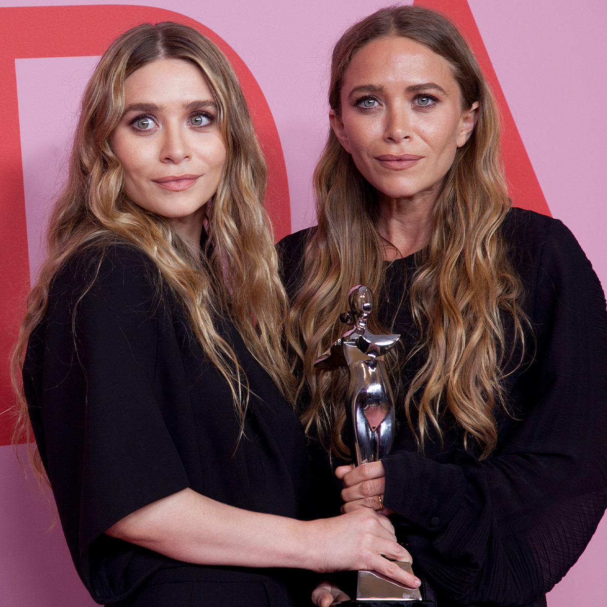 See Mary-Kate and Ashley Olsen’ Oversized Snacks at Paris Fashion Week