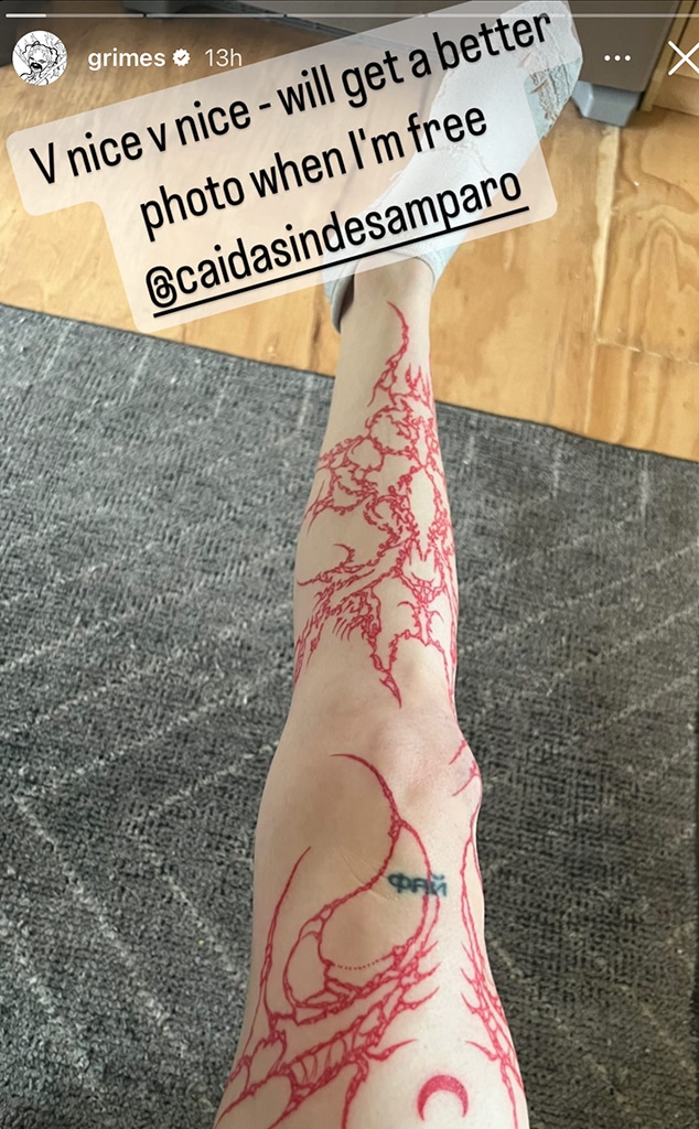 Grimes Debuts Massive Red Leg Tattoo