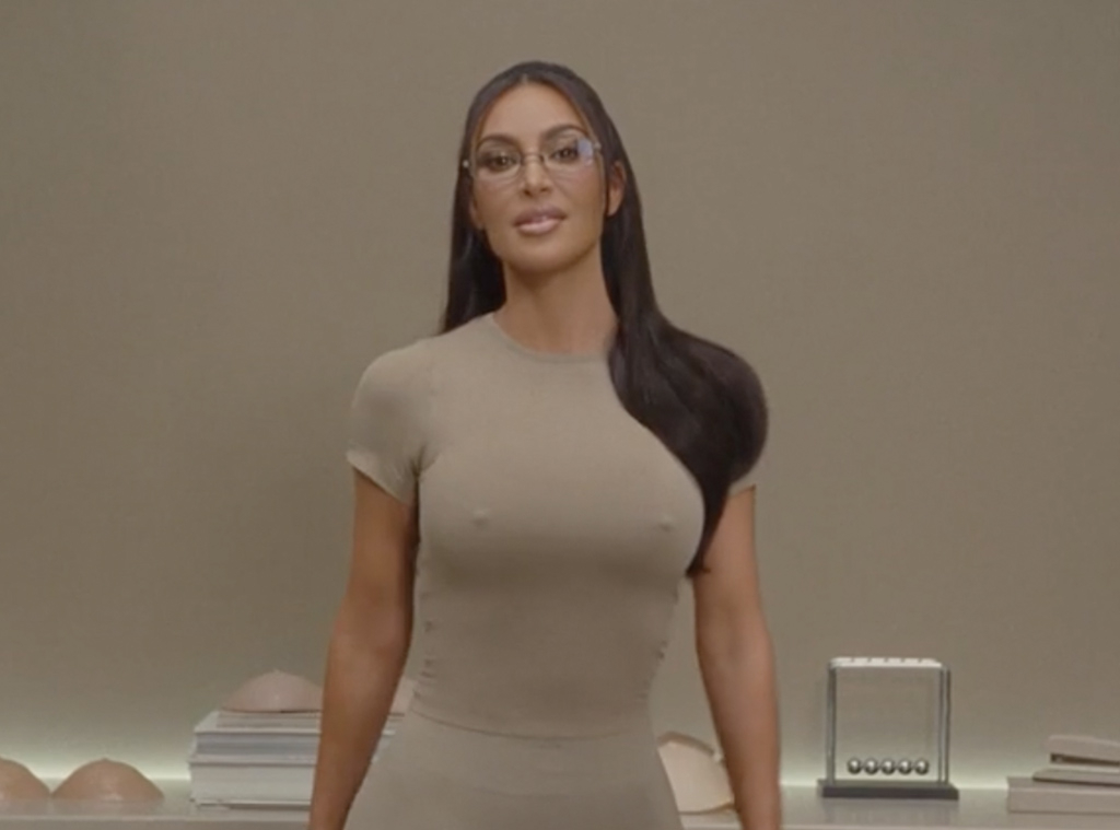 Kim Kardashian's skin is painted gold as she sports a sexy SKIMS