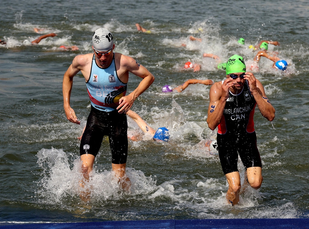 Belgium's Marten van Riel and Canada's Tyler Mislawchuk compete during the Olympic men's individual triathlon on July 31, 2024.