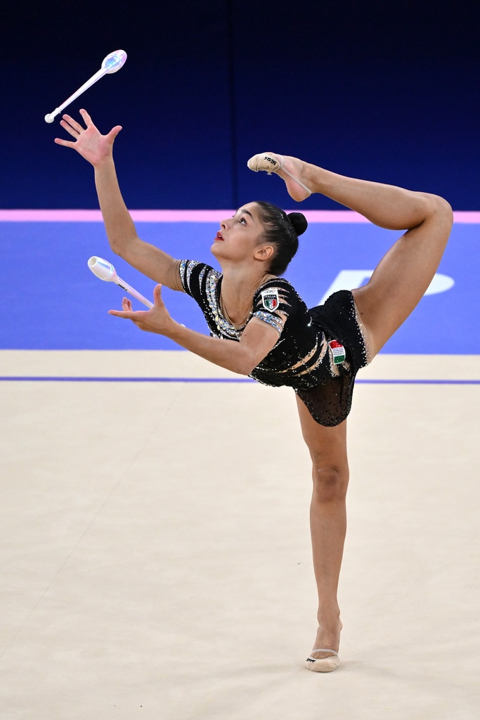 Flip Through How Artistic & Rhythmic Gymnastics Differ at the Olympics