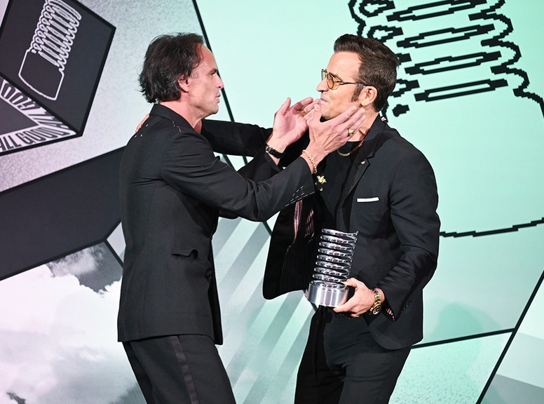 Walton Goggins and Justin Theroux speak onstage during the 29th Annual Webby Awards, Big Pic