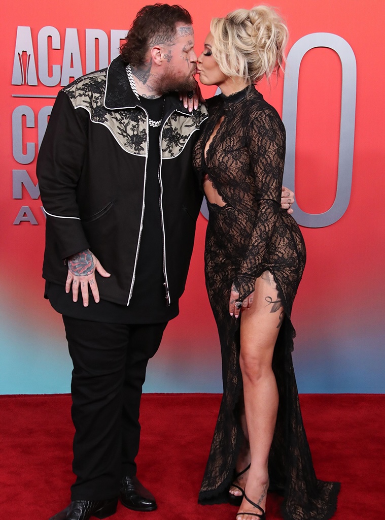 Jelly Roll and Bunnie Xo kiss on the red carpet of the 2025 Academy of Country Music Awards.