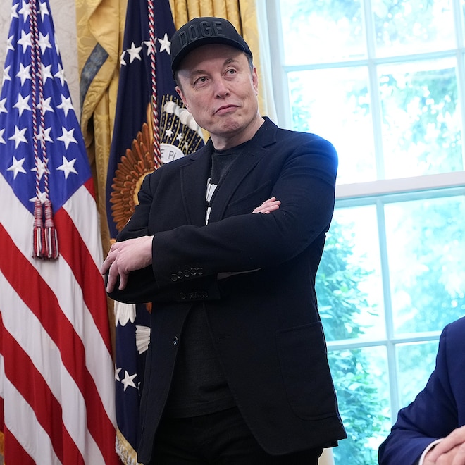 Tesla CEO Elon Musk and U.S. President Donald Trump listen to a question from reporters in the Oval Office of the White House