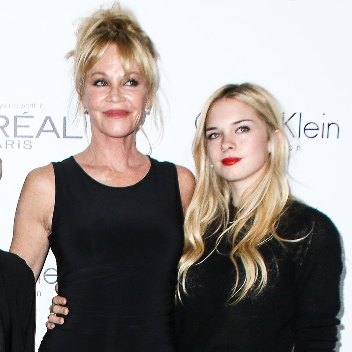 Melanie Griffith and Stella Banderas pose together on a red carpet.