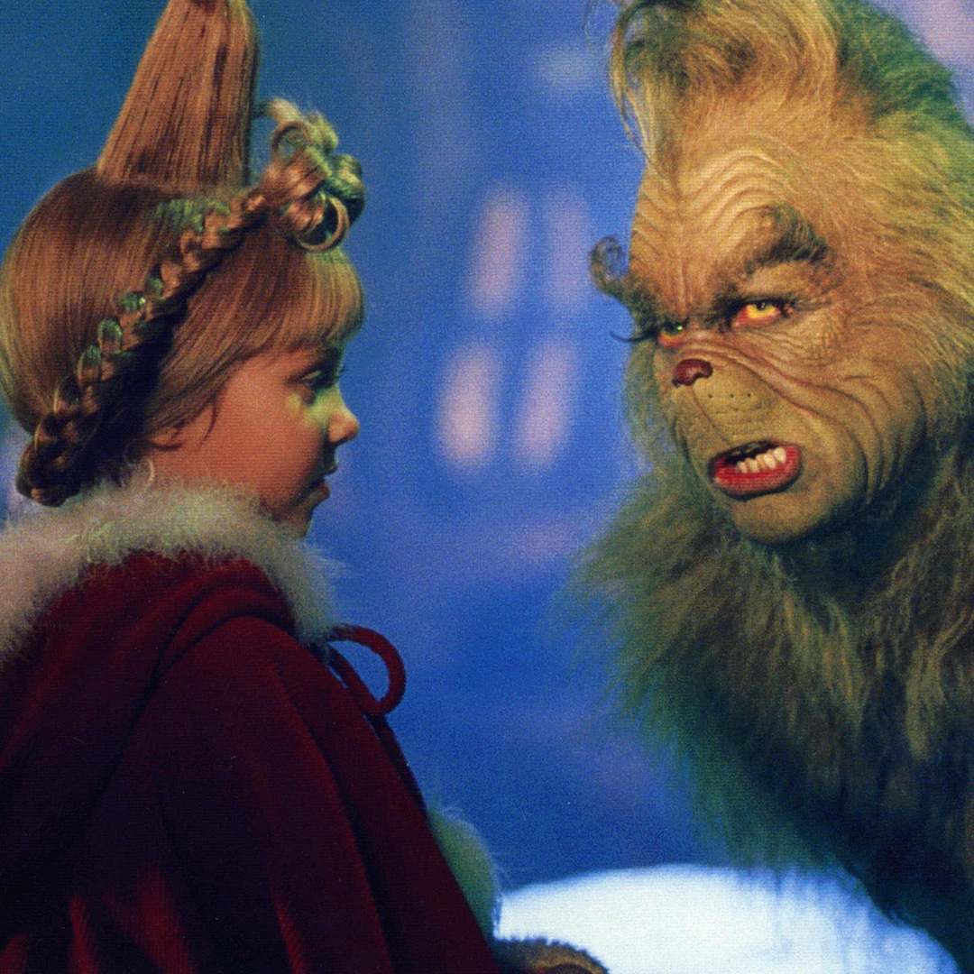 Джим Кери и Тейлър Момсен които участваха в How the Grinch