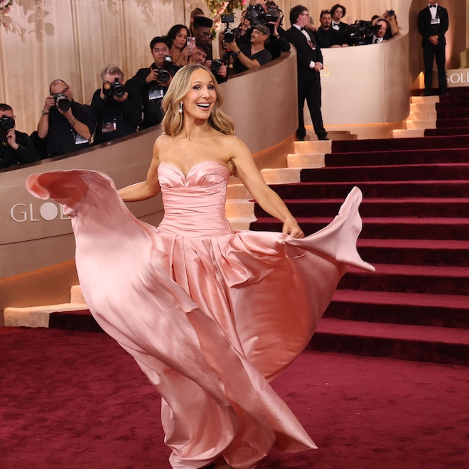 Nikki Glaser poses on Golden Globes 2026 red carpet steps