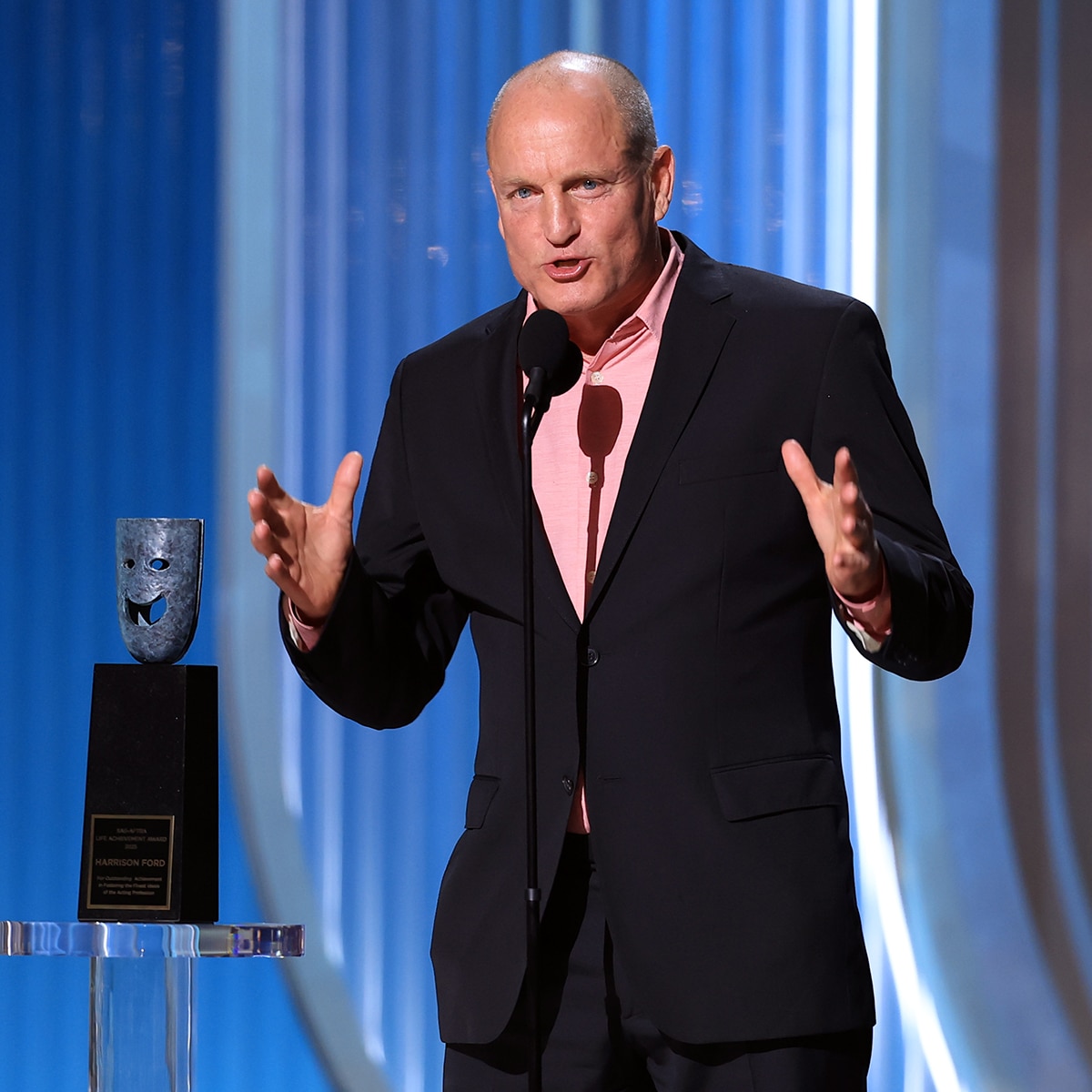 Woody Harrelson presents at the 2026 Actor Awards